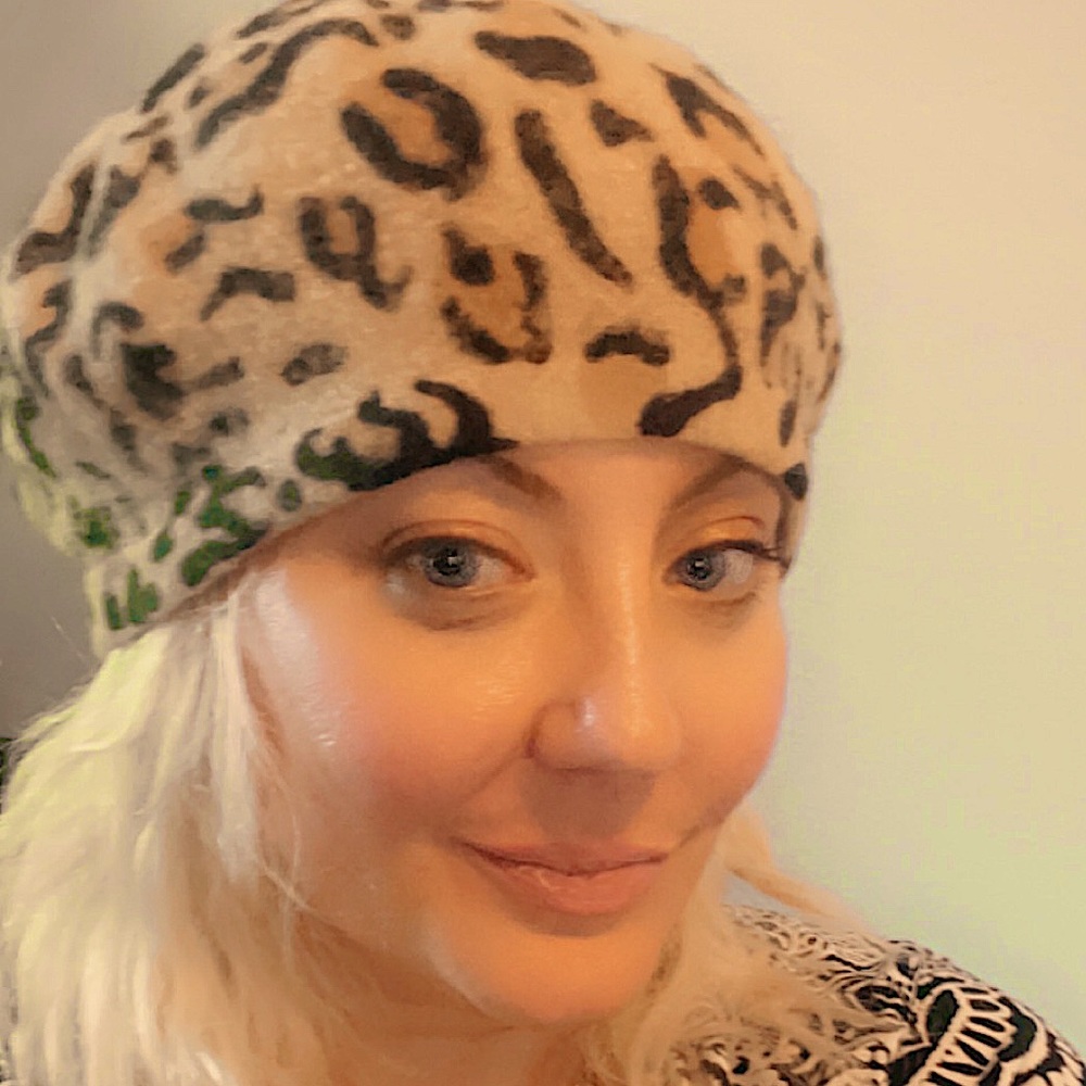 Beret/ tam. It’s a little fuzzy maybe felt but pretty soft